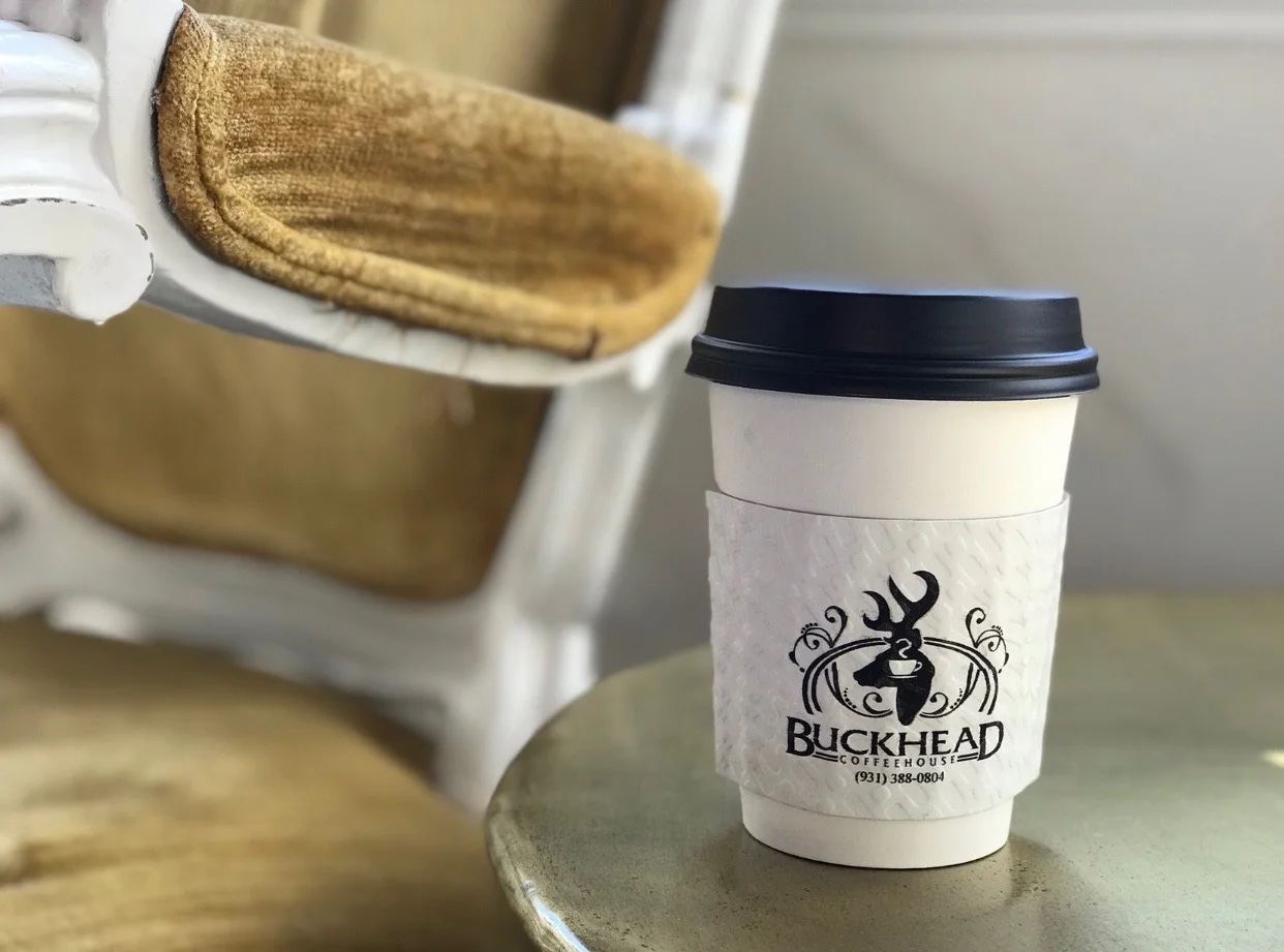 A Buckhead to-go cup on the counter